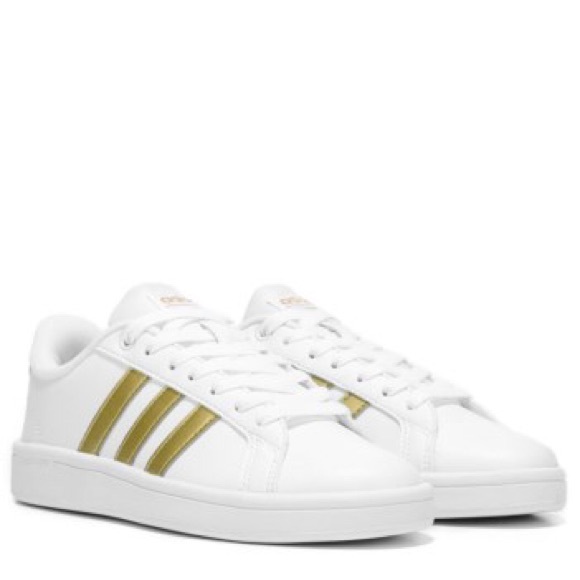 white adidas shoes with gold stripes